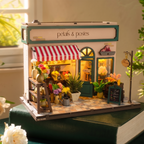 Petals & Posies assembled miniature flower shop with tiny blooms on a desk