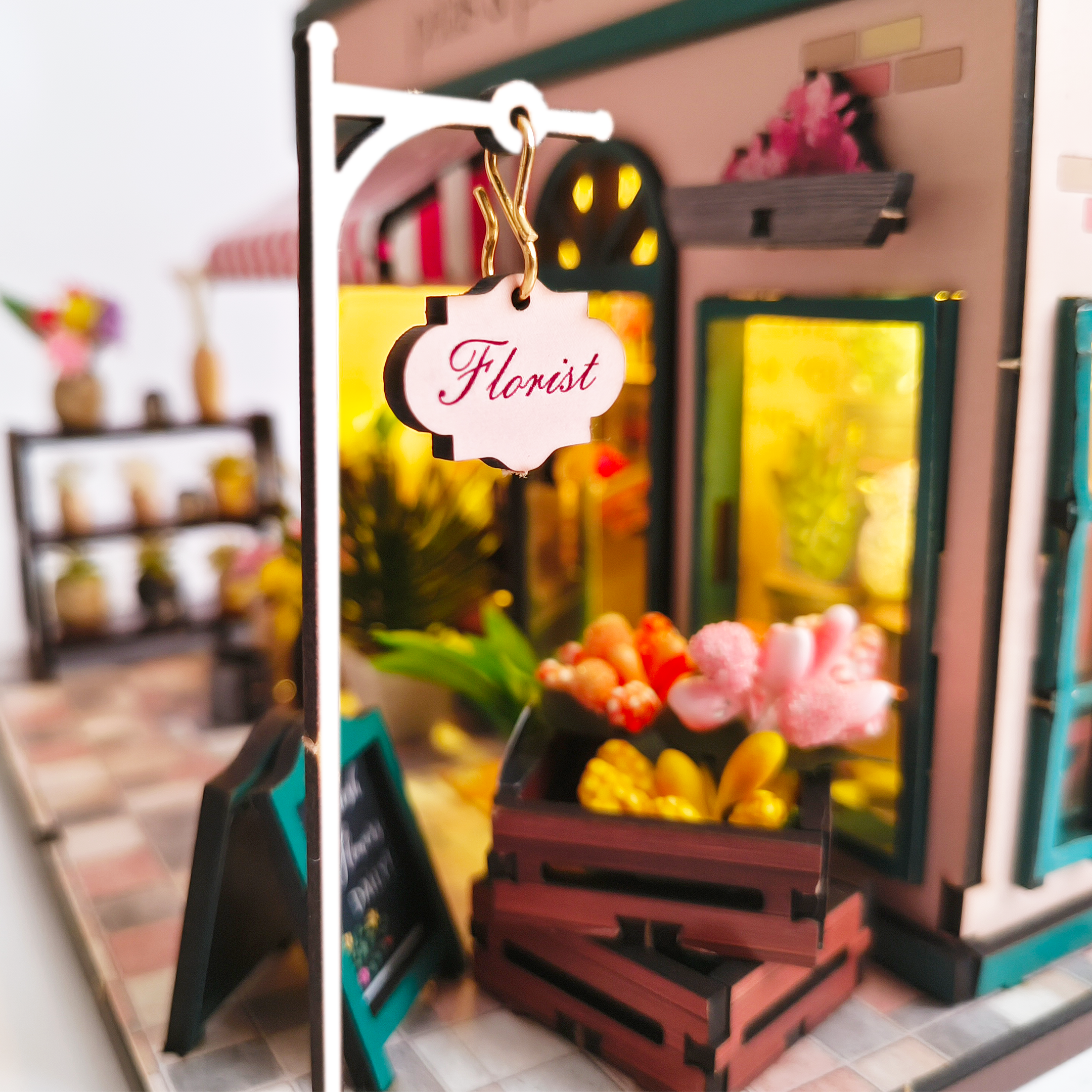 A zoom in on to the Florist sign at Petals and Posies